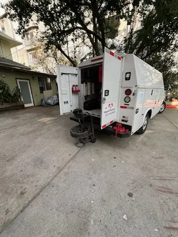 Magnet Plumbing service vehicle on-site for Grease Trap Cleaning in Clearwater